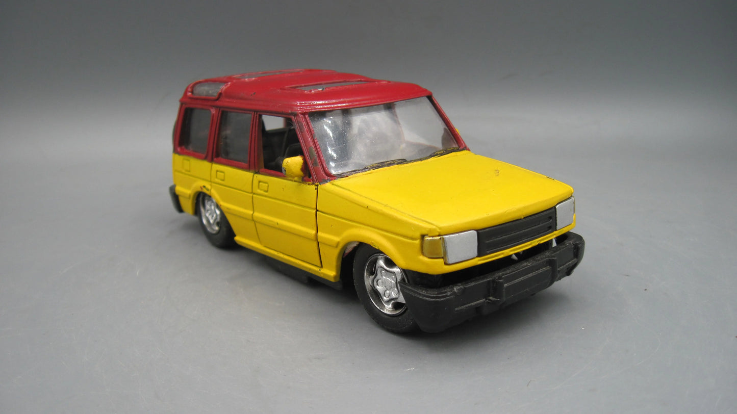 New Ray Land Rover Discovery 1 Maroon & Yellow