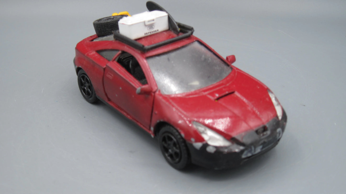 Kinsmart Toyota Celica Red Surfing boar and box on top