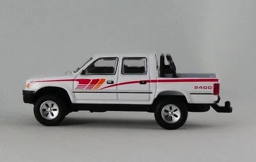 Jackie M Toyota Hillux White, Red Includes three barrels